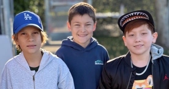 Boys standing together smiling