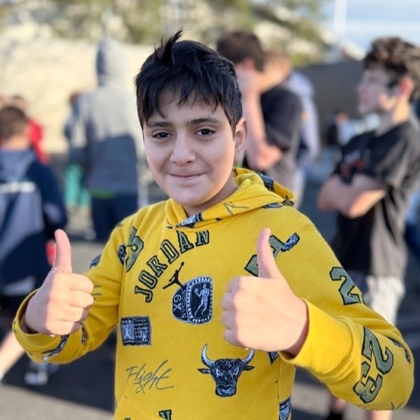 Boy with thumbs up