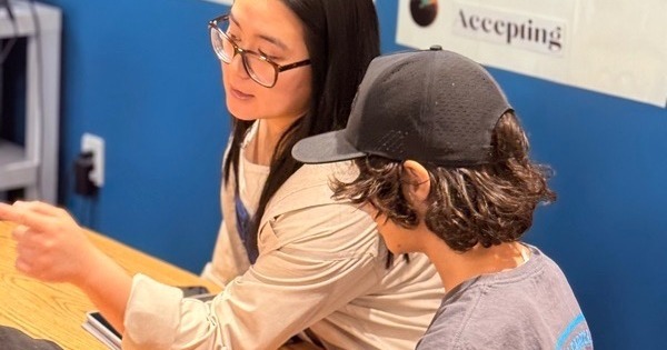 Teacher working with student