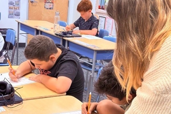 Teacher working with students