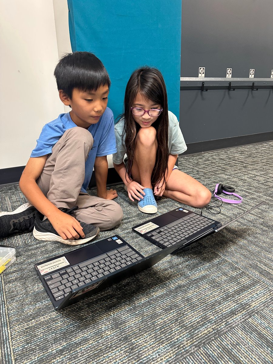 Students computing on floor