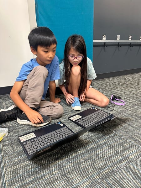 Students computing on floor