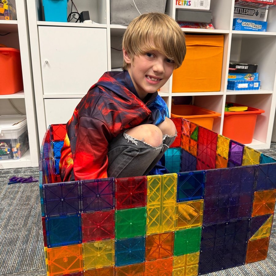 Student sitting in blocks Student sitting in blocks